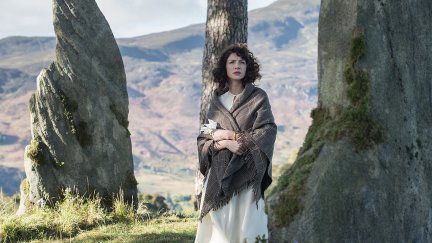 Claire (Caitriona Balfe) stands among a circle of stones in 'Outlander'