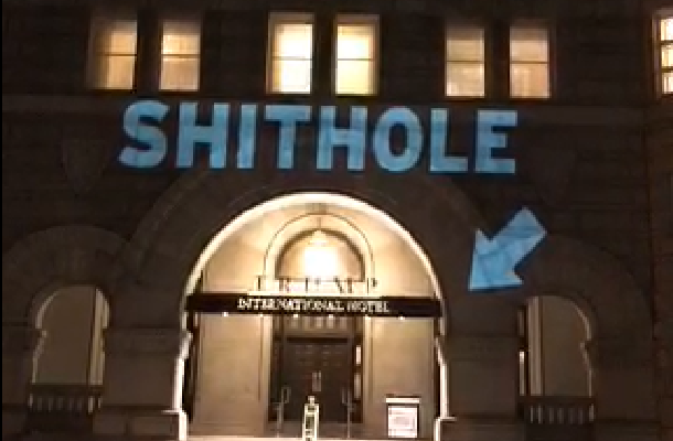 Screengrab of Robin Bell's Twitter video of "Shithole" projected onto Trump International Hotel