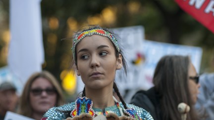 An indigenous woman dressed in traditional outfit during a solidarity rally with the Dakota Access Pipeline protesters on November 5, 2016 in Toronto, Canada.