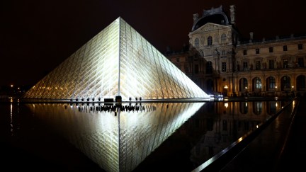 TOPSHOT - The Louvre Pyramid is illuminated in the night, prior to the Louis Vuitton Spring-Summer 2019 Ready-to-Wear collection fashion show in Paris, on October 2, 2018. (Photo by Bertrand GUAY / AFP) (Photo credit should read BERTRAND GUAY/AFP/Getty Images)