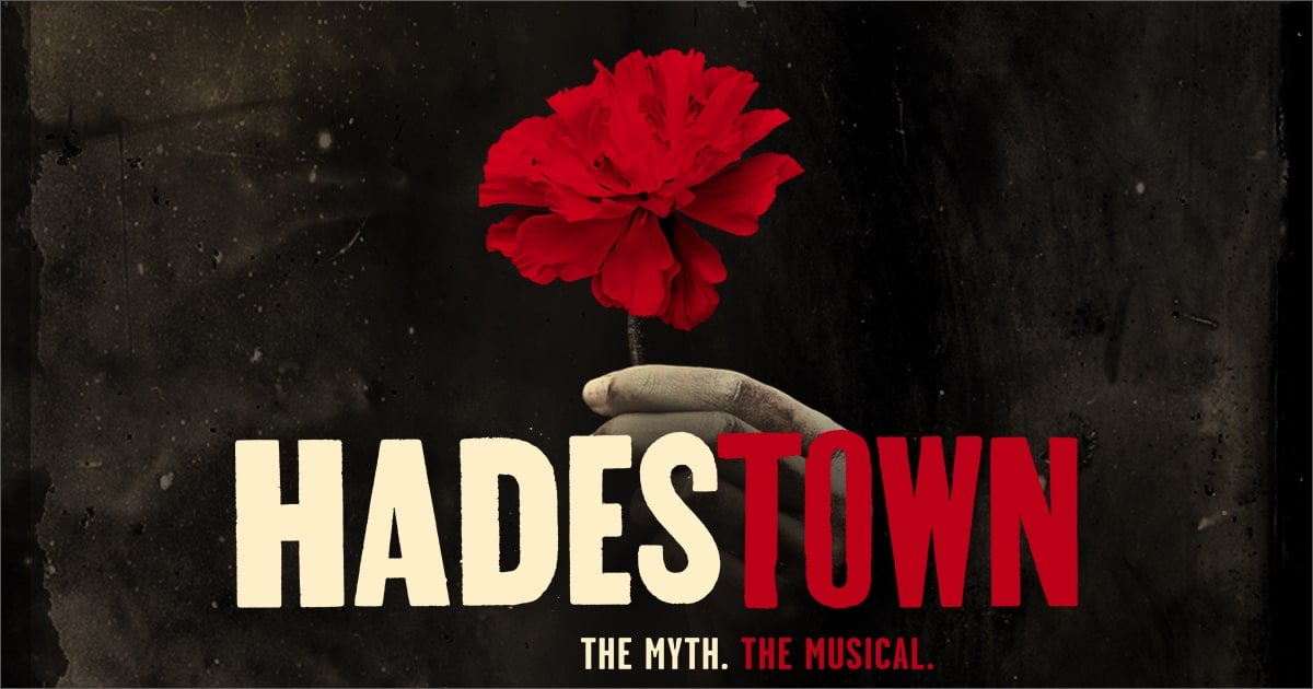 Hadestown musical title art of a hand holding a flower.