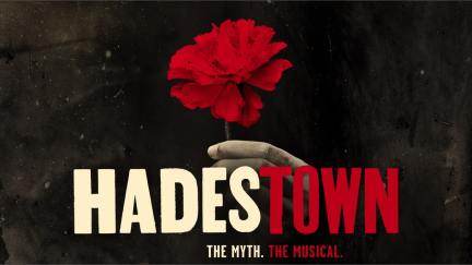 Hadestown musical title art of a hand holding a flower.