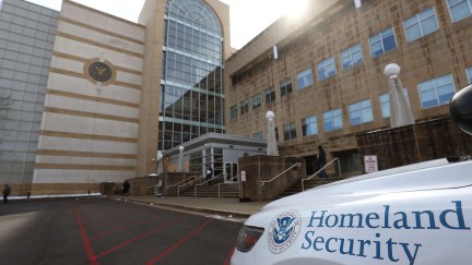 A Police car is parked in front of the United States District Court Greenbelt Division