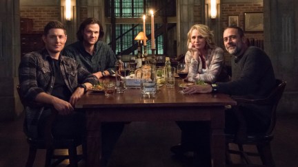 The whole Winchester family around a dinner table in Supernatural.