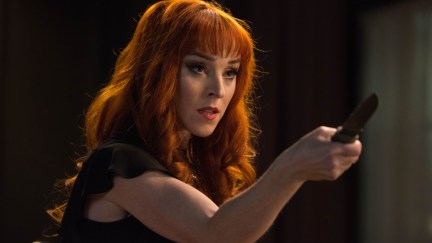 Actress Ruth Connell as Rowena brandishing a knife on Supernatural.