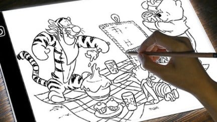 Winnie the Pooh drawing on a digital tablet.