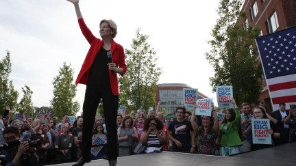 Sen. Elizabeth Warren (D-MA) waves during a campaign town hall