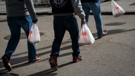 People carry plastic bags