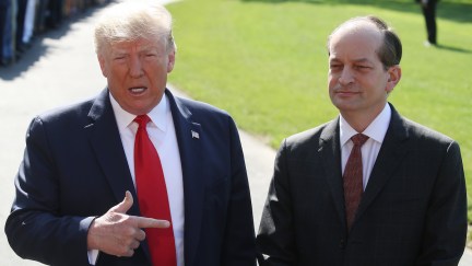 Trump defends Alex Acosta in front of reporters outside the White House.