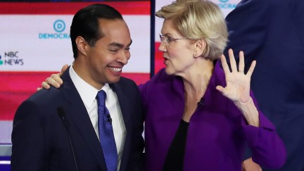 Julian Castro and Elizabeth Warren laugh together after the first Democratic primary debate.