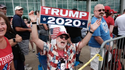 Donald Trump supporters gather outside of an arena