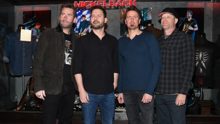 Nickelback Memorabilia Case Dedication At The Hard Rock LAS VEGAS, NV - FEBRUARY 22: (L-R) Frontman Chad Kroeger, guitarist Ryan Peake, drummer Daniel Adair and bassist Mike Kroeger of Nickelback attend a memorabilia case dedication ahead of the band's five-night 