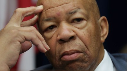 Rep. Elijah Cummings rests his temple to his fingers thoughtfully.