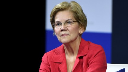 Elizabeth Warren seems to hold back a smirk.