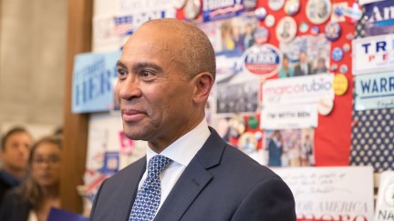 Former Massachusetts Governor Deval Patrick stands in the visitor center of the New Hampshire State House after he filed his paperwork to run for president in 2020