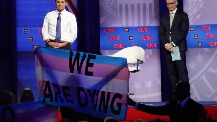 protestors display banners, protesting deadly violence against transgender women of color, at the Human Rights Campaign Foundation and CNN’s presidential town hall focused on LGBTQ issues on October 10, 2019 in Los Angeles, California.