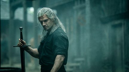 Henry Cavil scowls in a dark city in the witcher