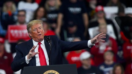 Donald Trump speaks and gestures wildly during a campaign rally