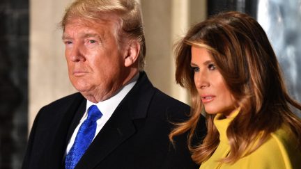 Donald and Melania Trump look very serious.