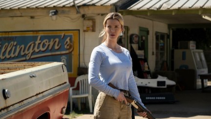 Betty Gilpin holds a shotgun in a still from The Hunt.