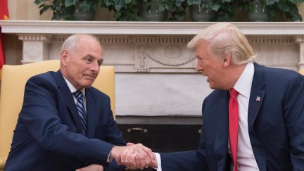 Donald Trump (R) shakes hands with newly sworn-in White House Chief of Staff John Kelly at the White House