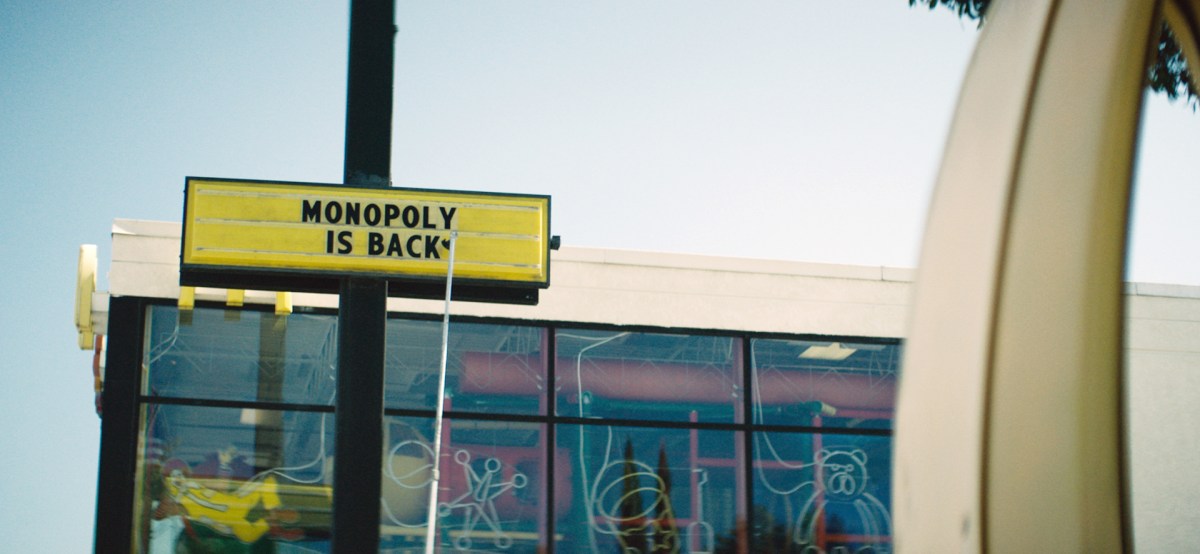 Monopoly is back sign in front of a mcdonalds