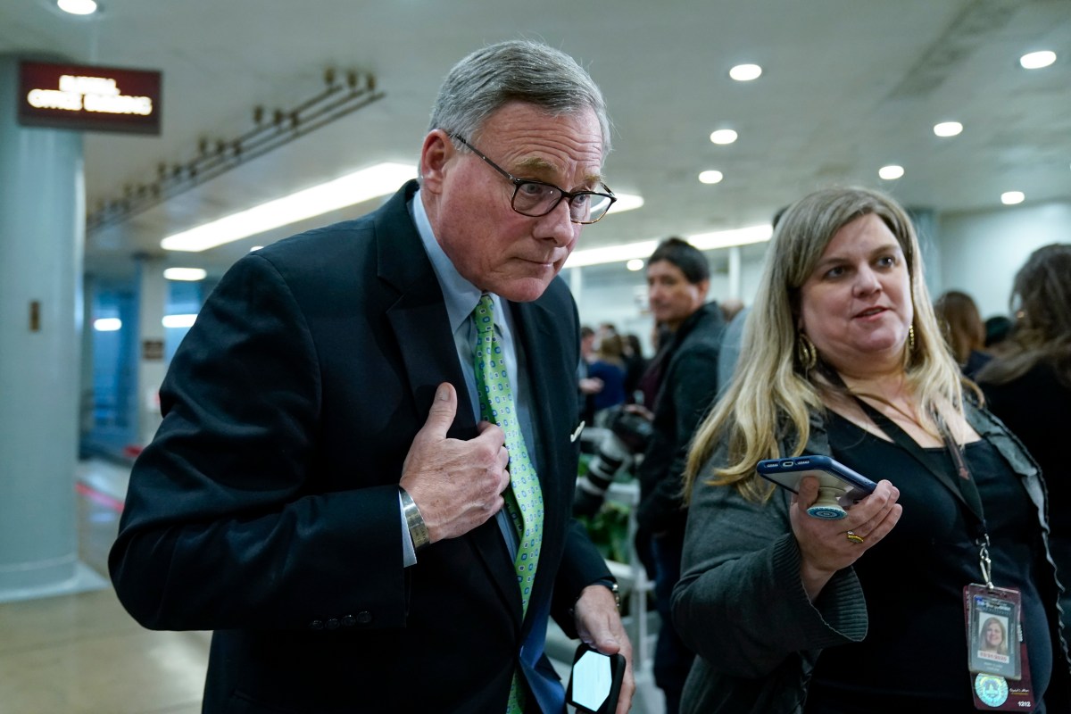 WASHINGTON, DC - JANUARY 23: Sen. Richard Burr (R-NC) speaks with a reporter as he walks through the Senate subway before the impeachment trial of President Donald Trump resumes at the U.S. Capitol on January 23, 2020 in Washington, DC. Democratic House managers will continue their opening arguments on Thursday as the Senate impeachment trial of President Donald Trump continues. (Photo by Drew Angerer/Getty Images)