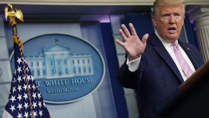 Donald Trump gestures as he rants during a press briefing.