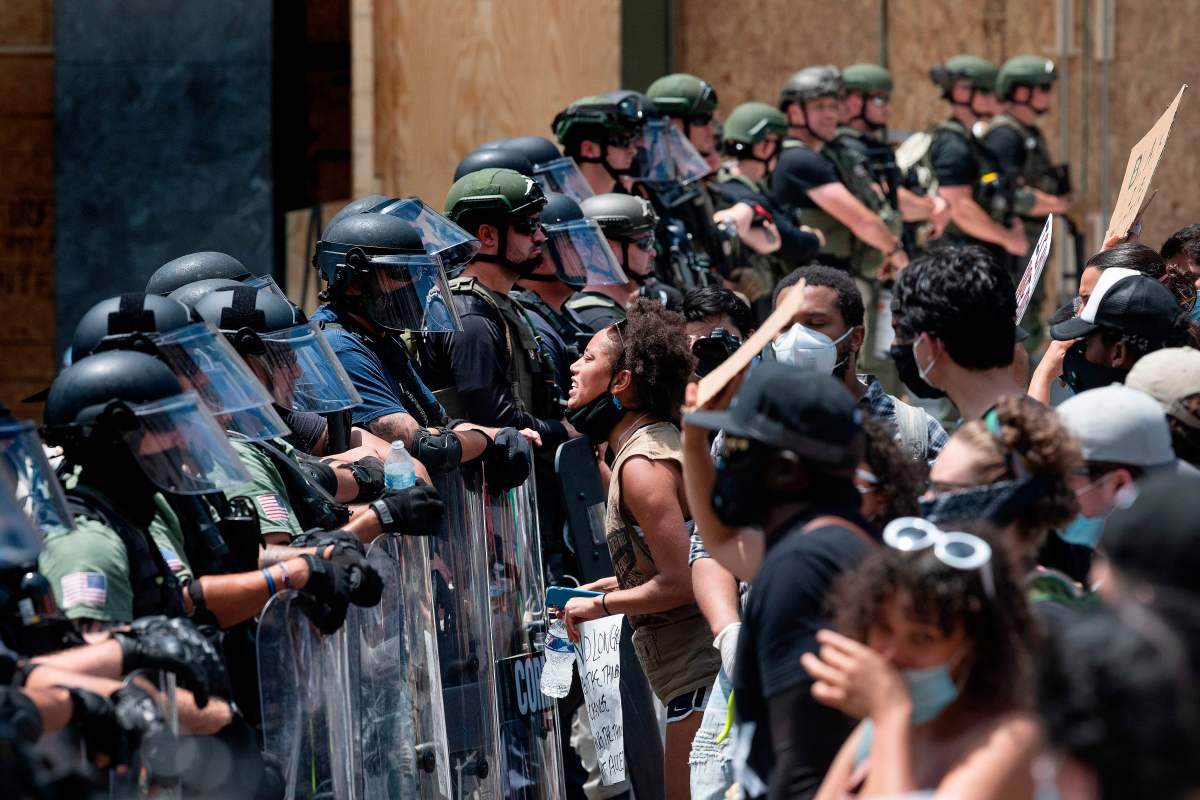 Protesters demonstrate over the death of George Floyd near the White House on June 3, 2020, in Washington, DC. - The United States has erupted into days and nights of protests, violence, and looting, following the death of George Floyd after he was detained and held down by a knee to his neck, dying shortly after. (Photo by JIM WATSON / AFP) (Photo by JIM WATSON/AFP via Getty Images)