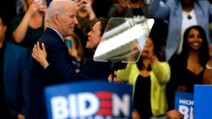 California Senator Kamala Harris (C) hugs Democratic presidential candidate former Vice President Joe Biden after she endorsed him at a campaign rally at Renaissance High School in Detroit, Michigan on March 9, 2020. (Photo by JEFF KOWALSKY / AFP) (Photo by JEFF KOWALSKY/AFP via Getty Images)