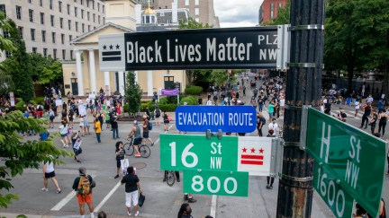 People walk near 16th and H street after volunteers, with permission from the city, painted 