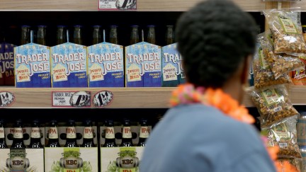 A Trader Joe's customer looks at Trader Jose branded beer.