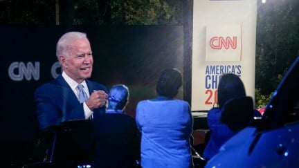 Joe Biden is projected onto a drive-in screen for CNN's town hall event.