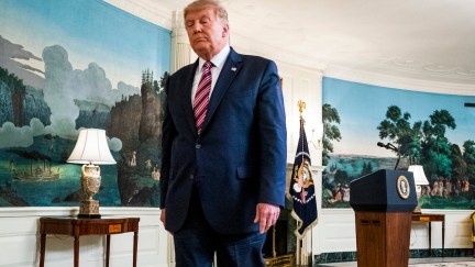 Donald Trump walks through the Diplomatic Reception Room of the White House