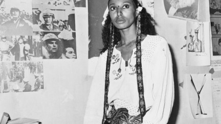 American model and actress Donyale Luna (1945 – 1979) in Italy, 1973. On the wall behind her are pictures of Mahatma Gandhi and Karl Marx. (Photo by Keystone/Hulton Archive/Getty Images)