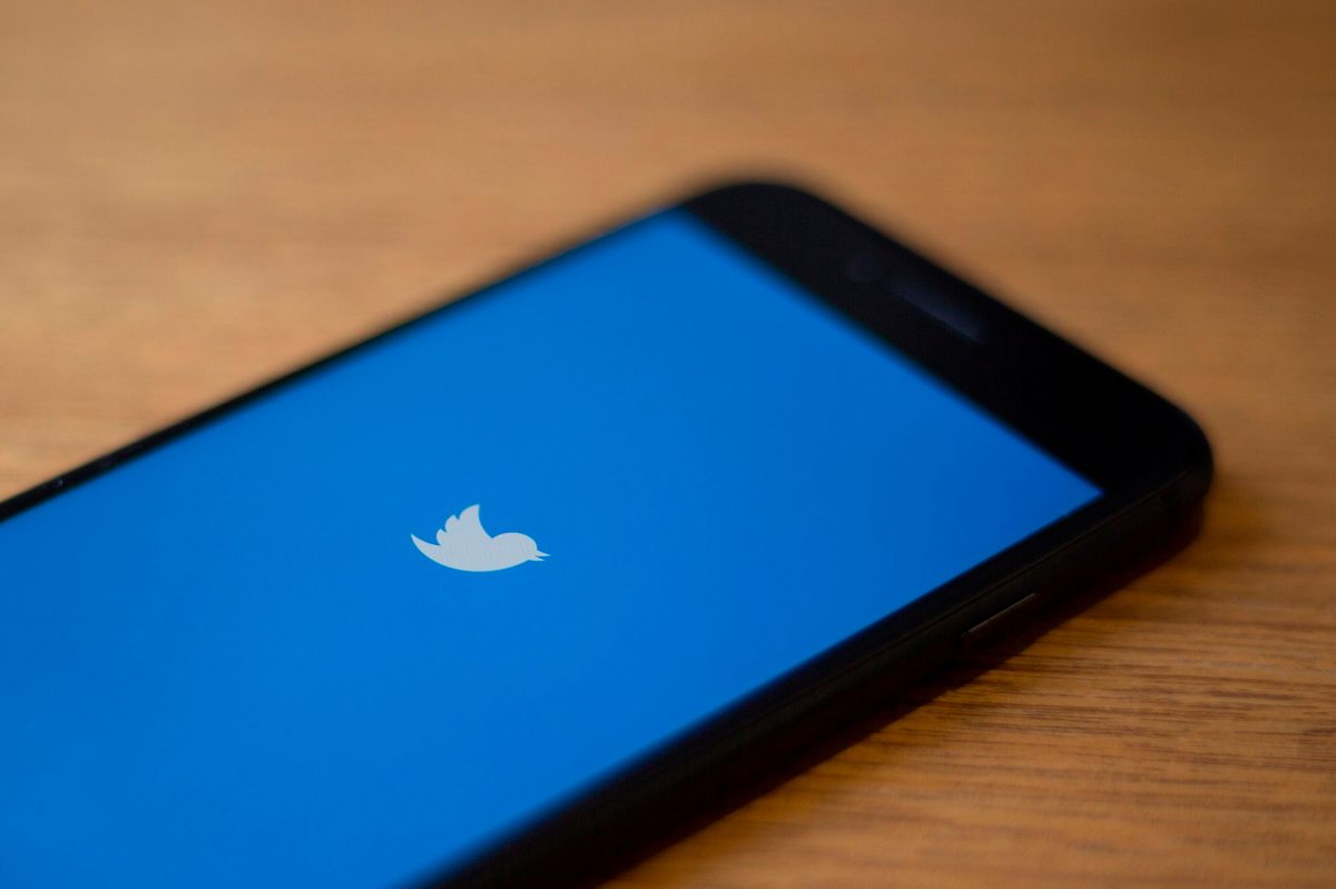 The Twitter logo is seen on a phone in this photo illustration in Washington, DC, on July 10, 2019. - Twitter is moving to filter out inappropriate content based on religion as part of its effort to curb hate speech. In a policy update on July 9, 2019, Twitter said it would take down "dehumanizing language" that targets specific religious groups.Examples shown by Twitter that would be removed would be description of a members of a religion as "disgusting" or "filthy animals." (Photo by Alastair Pike / AFP) (Photo credit should read ALASTAIR PIKE/AFP via Getty Images)