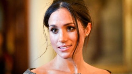 Meghan Markle chats with people inside the Drawing Room during a visit to Cardiff Castle.