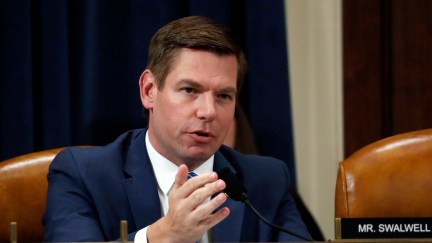 Rep. Eric Swalwell speaks from his desk in the House.