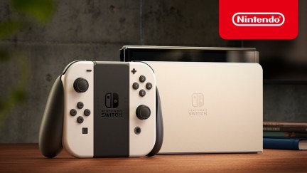 Nintendo Switch OLED model with larger screen, ethernet port.