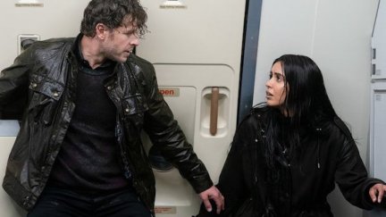 Josh Dallas and Parveen Kaur as Ben and Saanvi soaked on a plane on 'Manifest'