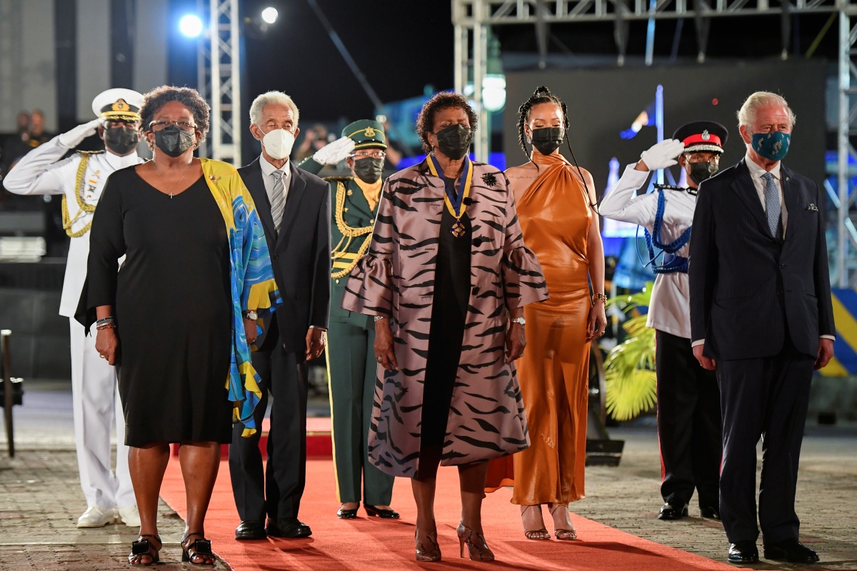 BRIDGETOWN, BARBADOS - NOVEMBER 30: Prime Minister of Barbados Mia Mottley, former cricketer Garfield Sobers, President of Barbados, Dame Sandra Mason, Rihanna, and Prince Charles, Prince of Wales stand during the Presidential Inauguration Ceremony at Heroes Square on November 30, 2021 in Bridgetown, Barbados. The Prince of Wales arrived in the country ahead of its transition to a republic within the Commonwealth. This week, it formally removes Queen Elizabeth as its head of state and the current governor-general, Dame Sandra Mason, will be sworn in as president. (Photo by Toby Melville - Pool/Getty Images)