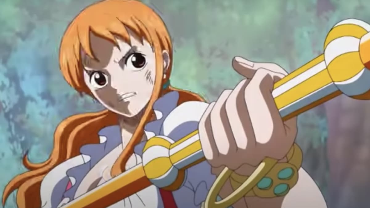 Nami in One Piece holding a gold staff. 