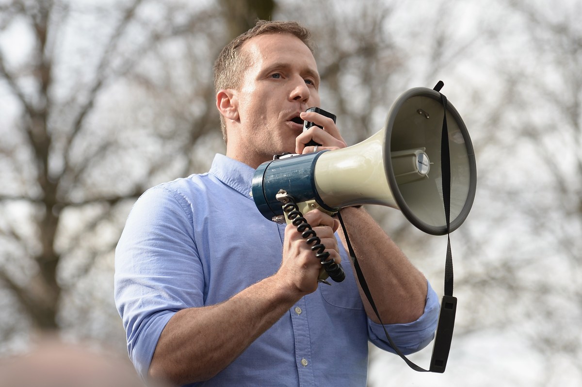 Eric Greitens speaks into a megaphone