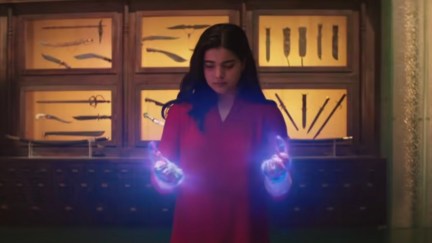 Kamala Khan looks over her glowing hands in Ms. Marvel.