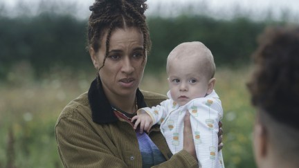 The Baby trailer screencap of a woman holding a baby.