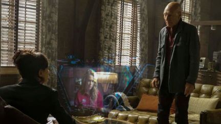 the watcher sits while Picard stands and stares at a hologram