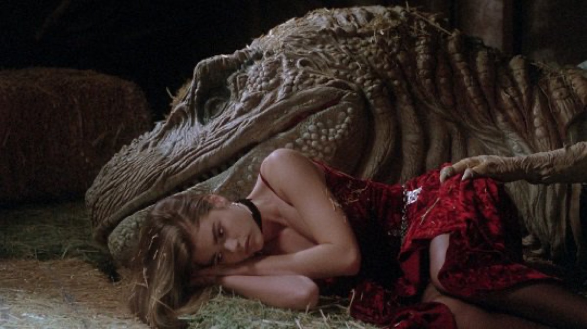 Tammy lying down next to a T-Rex's head in Tammy and the T-Rex.