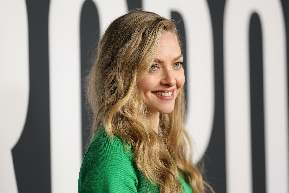 Amanda Seyfried smiles on a red carpet.