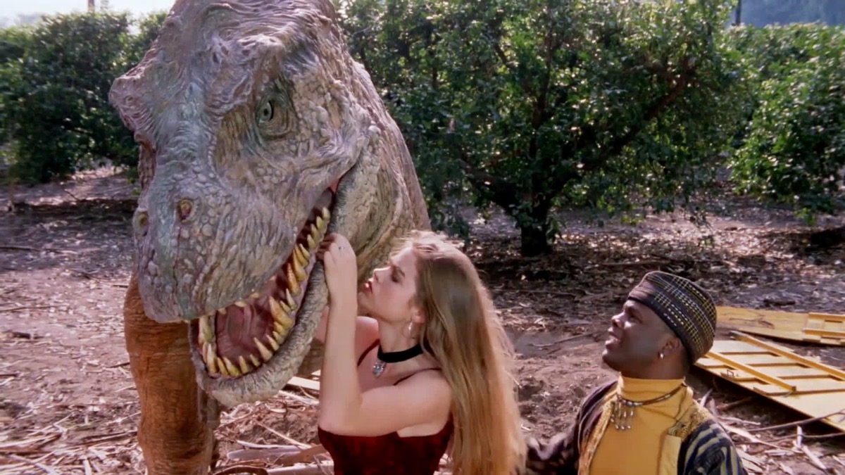 Tammy inspects the mouth of a T-Rex in Tammy and the T-Rex.