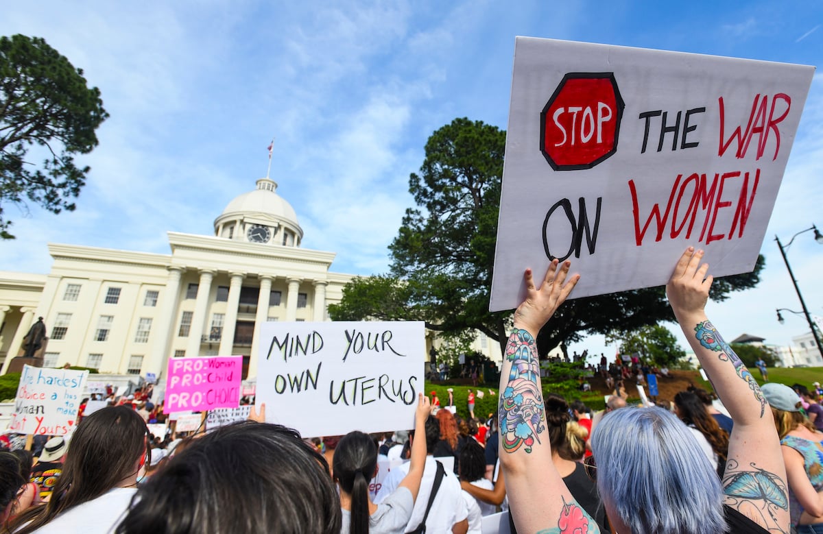 A crowd of abortion advocates protest outside the Alabama statehouse.